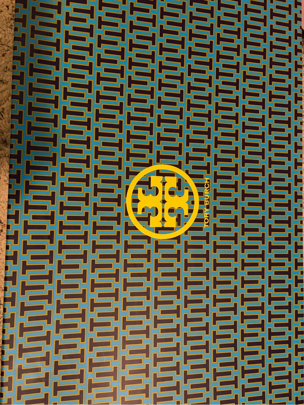Tory Burch Teal and Yellow Geometric Logo Wallpaper